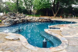 A residential fiberglass inground swimming pool